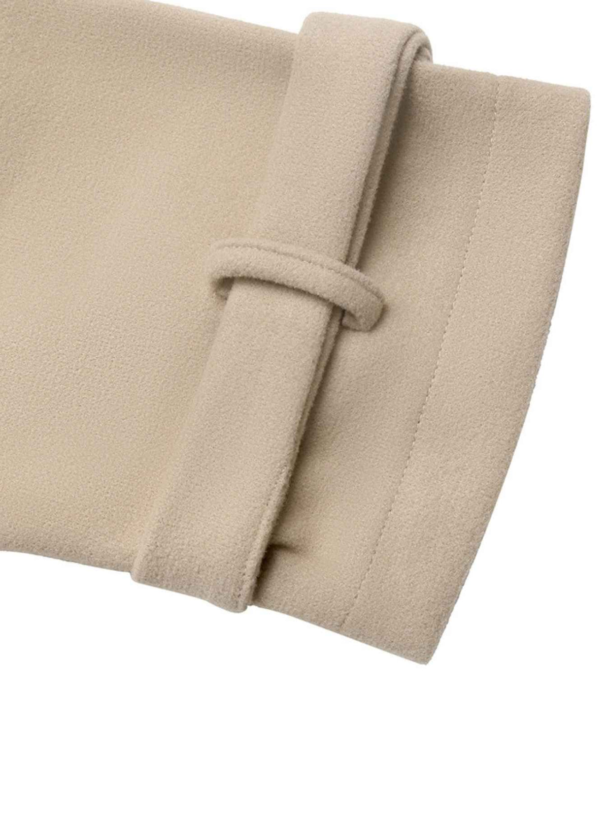 Close-up of a beige fabric accessory with a wide strap and loop closure, shown against a plain white background.