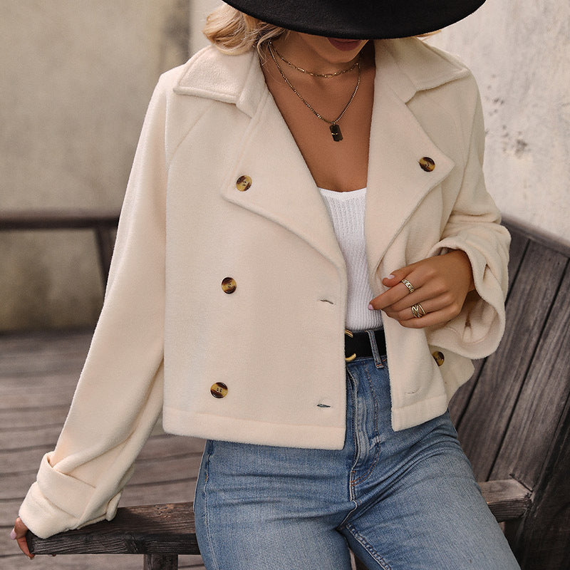 Side view of the cream double breasted jacket with tortoiseshell effect buttons