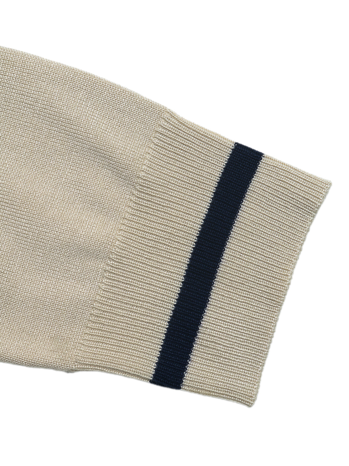 Close-up of a ribbed knit sleeve in warm beige with a single dark navy stripe near the cuff, shown on a plain white background.