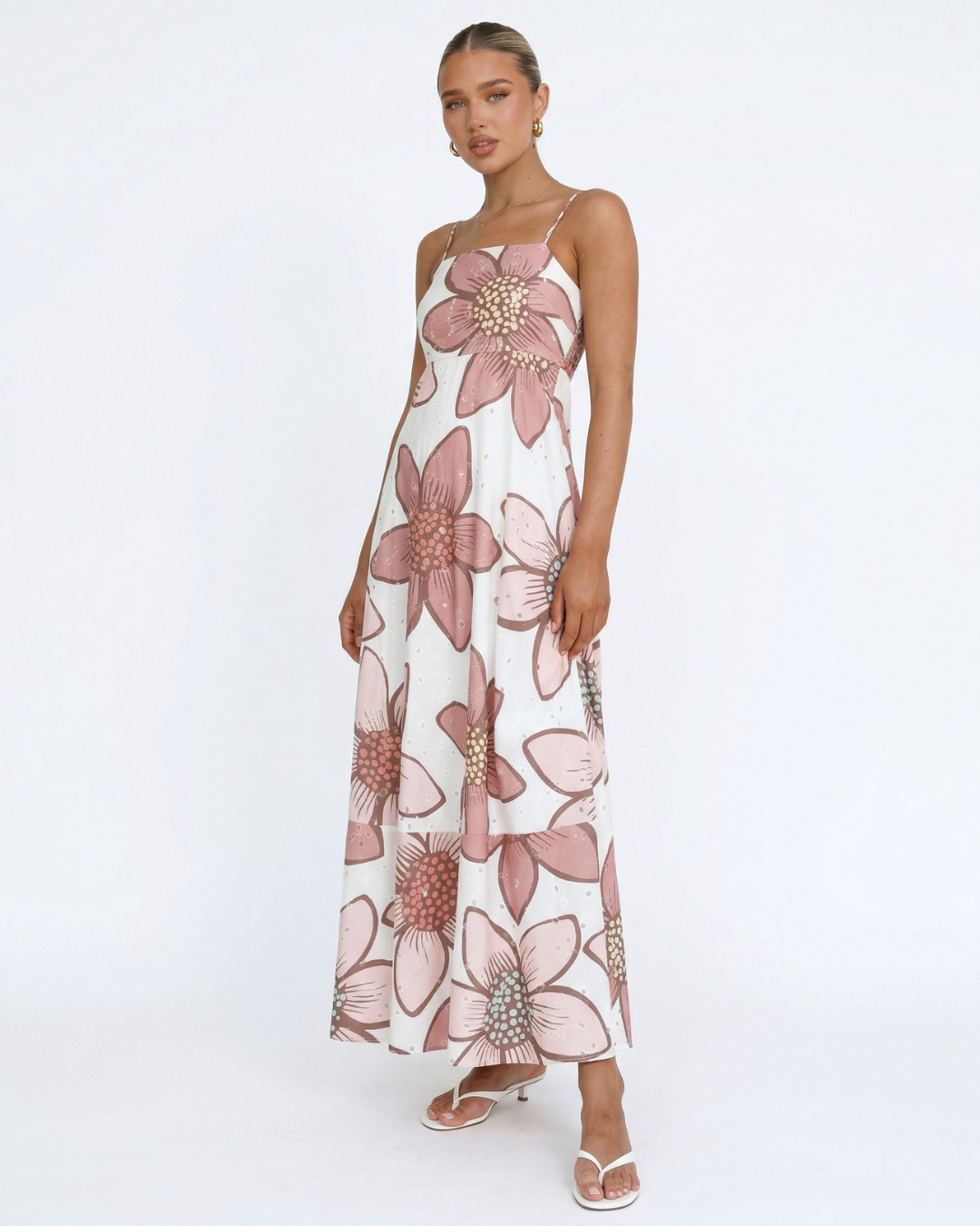 Woman wearing a floral dress on a white background
