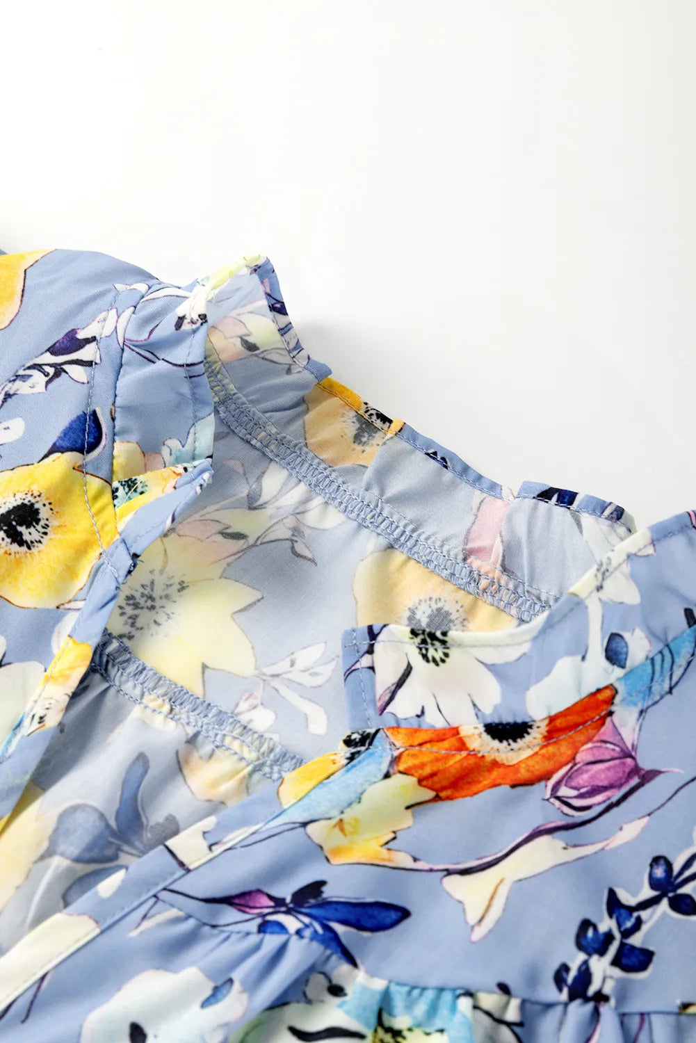 Floral Blouse with Flutter Sleeves and V-Neckline