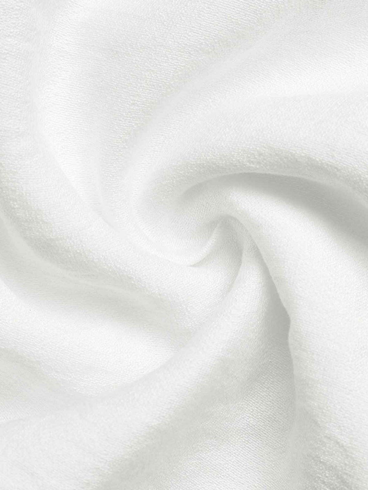 A close-up of white textured fabric with soft folds and a slightly sheer, gauzy appearance.