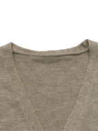 Close-up of a knit V-neck sweater in a warm taupe-beige color, showing the fine texture of the fabric and the inner collar construction against a plain white background.