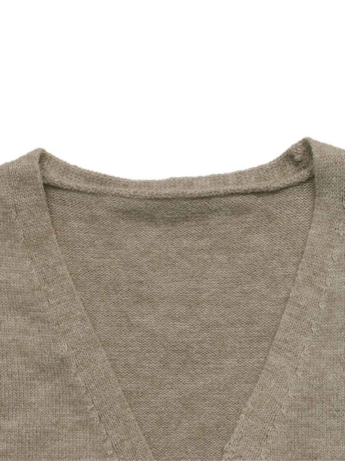 Close-up of a knit V-neck sweater in a warm taupe-beige color, showing the fine texture of the fabric and the inner collar construction against a plain white background.