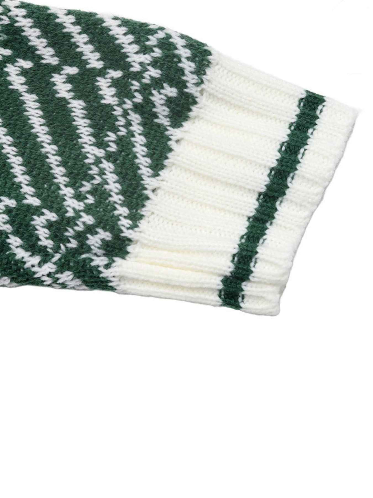 Close-up of a knit sleeve or cuff with a green and white patterned section transitioning into a ribbed white cuff with a dark green stripe, on a white background.