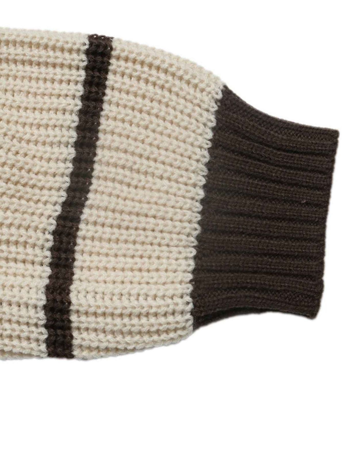 Close-up of a ribbed knit sleeve in cream and dark brown, showing the texture and color blocking details against a white background.