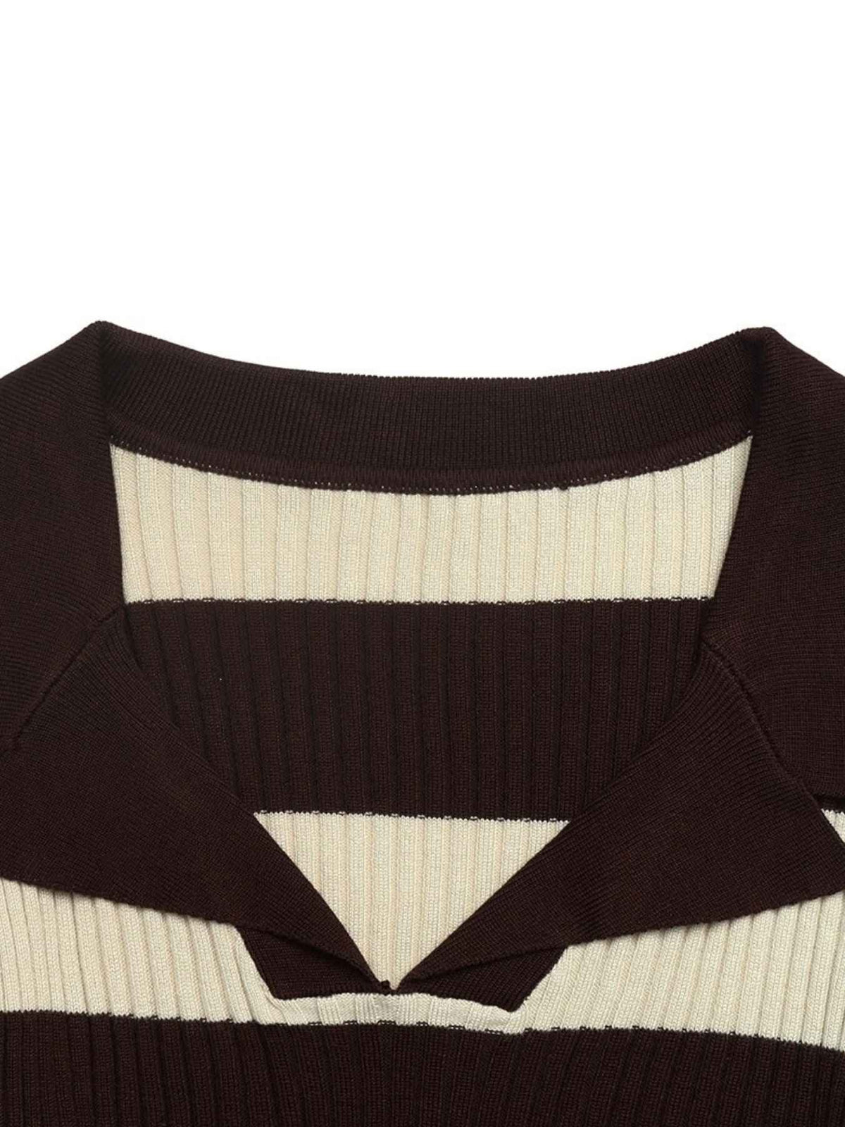 Close-up of a ribbed knit sweater with horizontal stripes in dark brown and cream, featuring a split V-neckline.