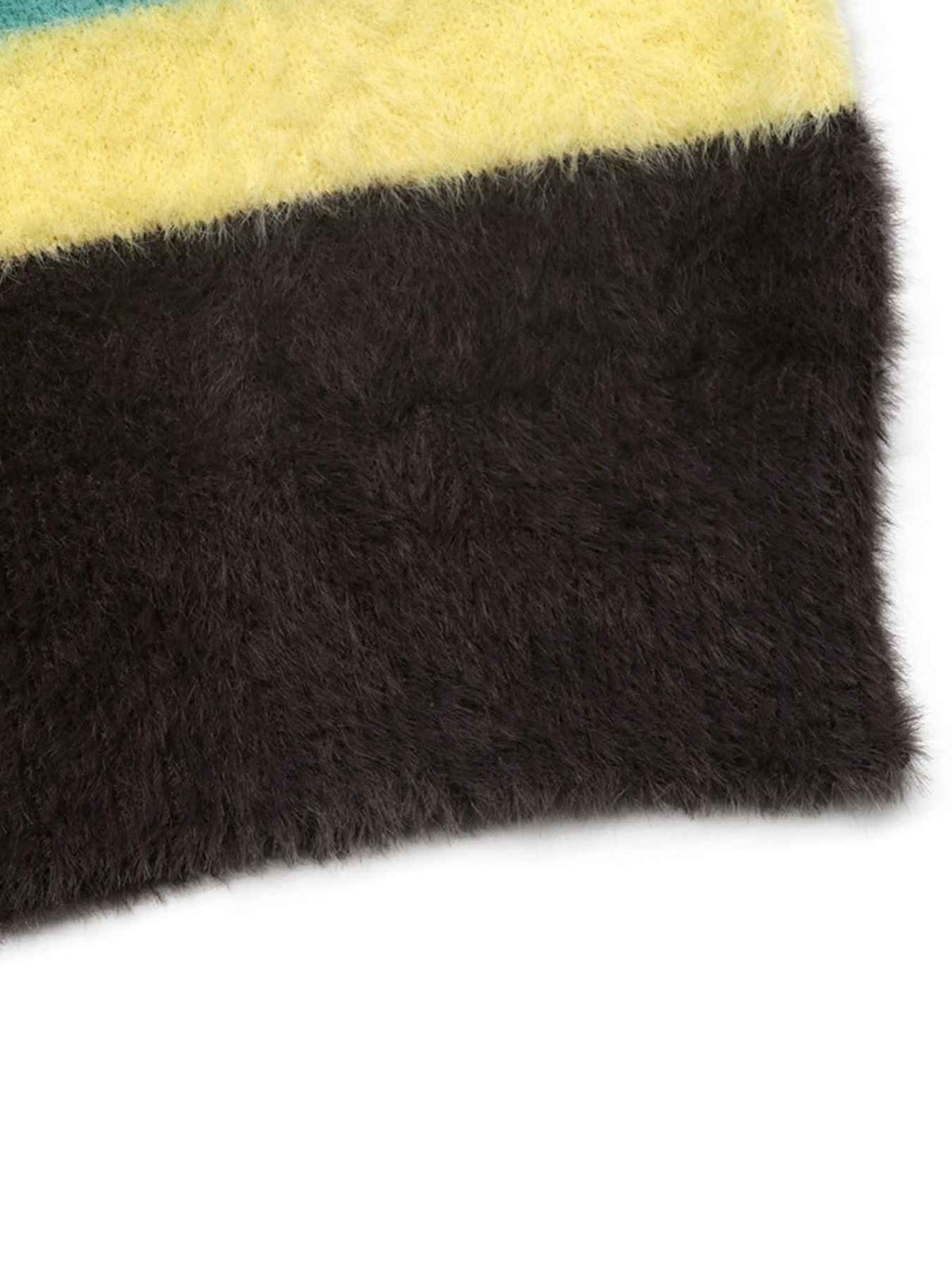 A close-up of a shaggy faux fur textile with a wide dark brown section and a yellow section above it, photographed on a white background.
