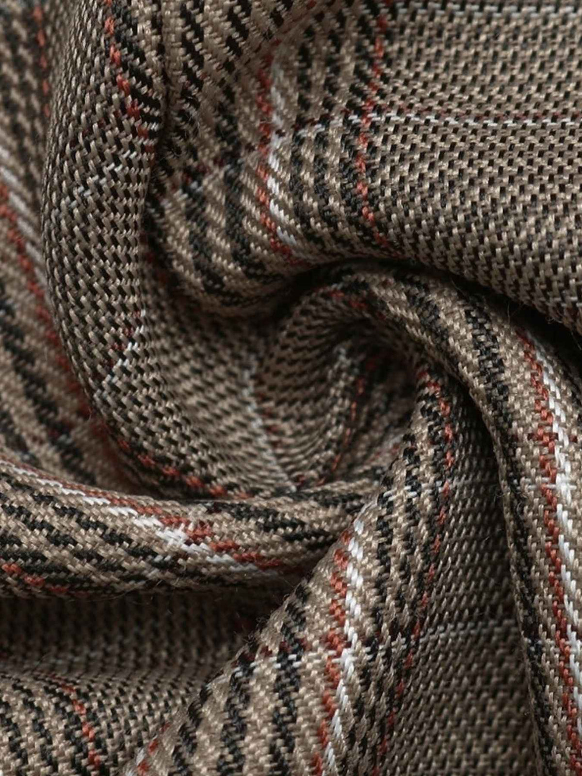 A close-up of a textured woven fabric with a plaid pattern in taupe, brown, black, and thin red stripes, arranged in a swirl.