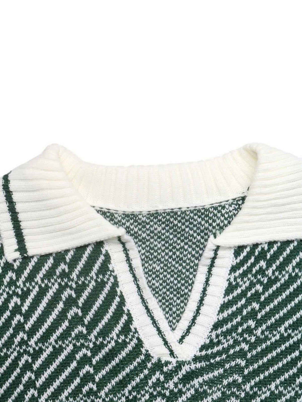 Close-up of a knit sweater showing a white ribbed polo collar and a green-and-white striped V-neck trim on a dark green patterned body, photographed against a white background.
