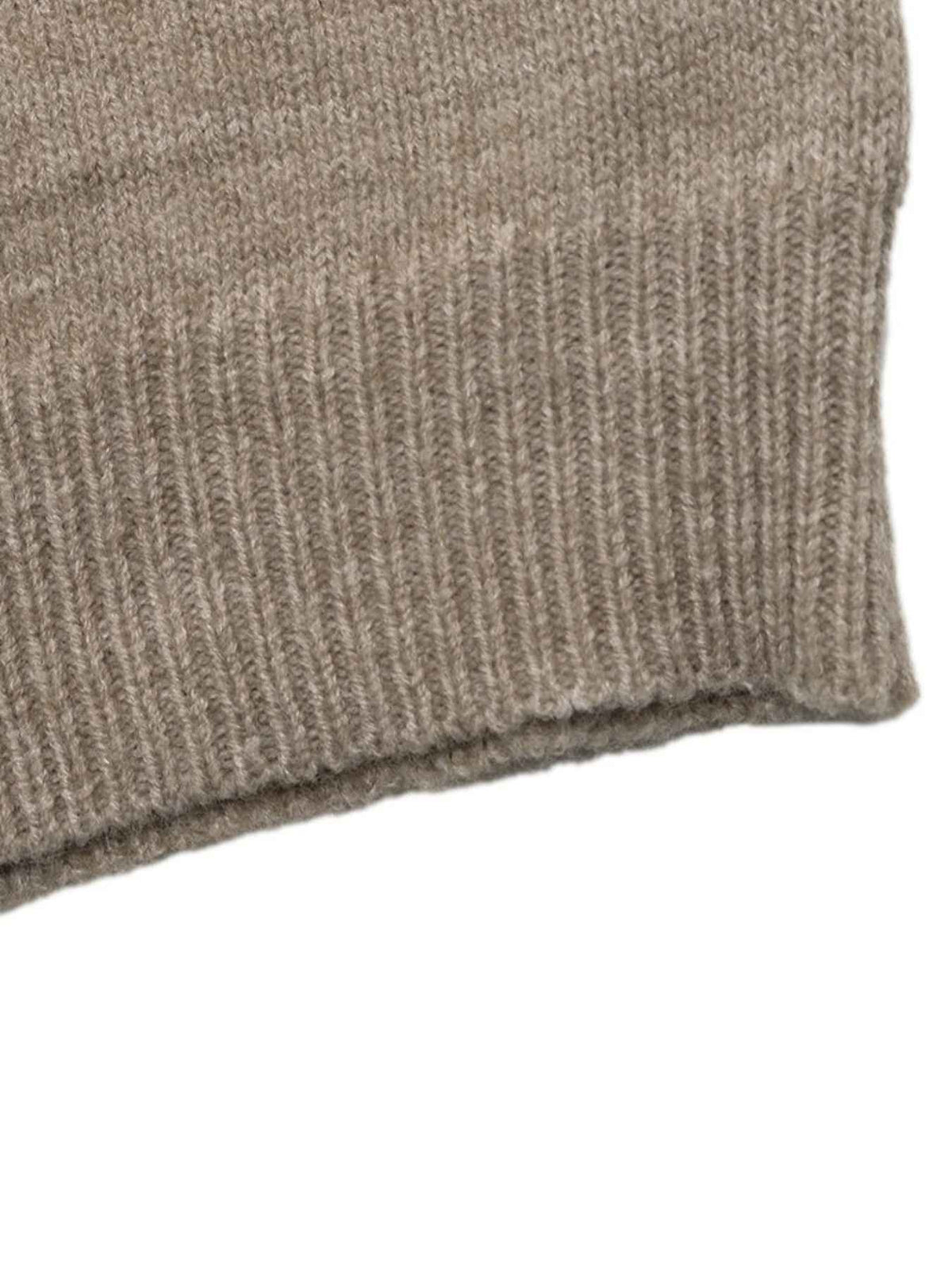 Close-up of a ribbed knit fabric cuff in a heathered taupe-brown color, showing the texture and edge against a plain white background.