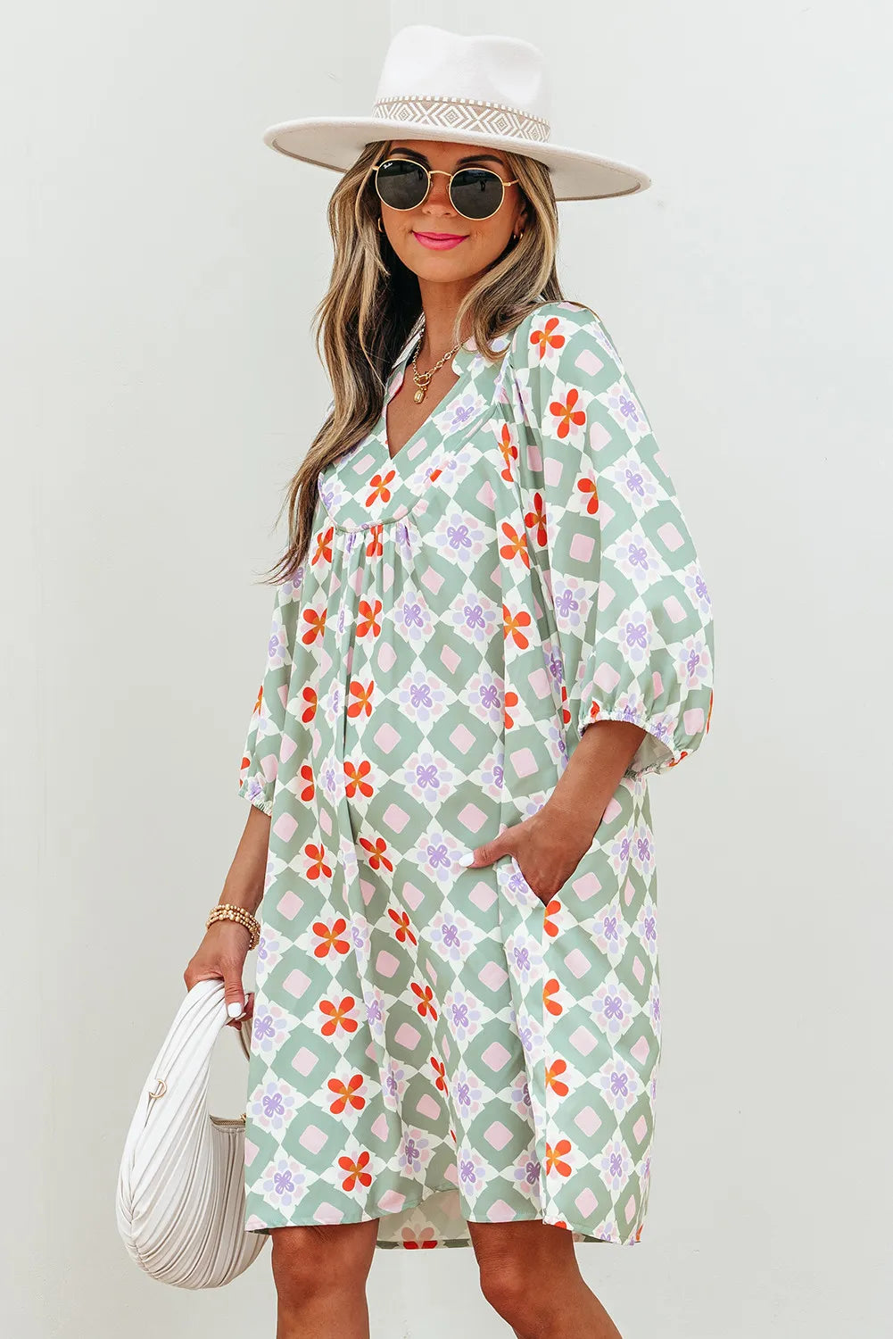 Woman wearing a floral dress with a white background