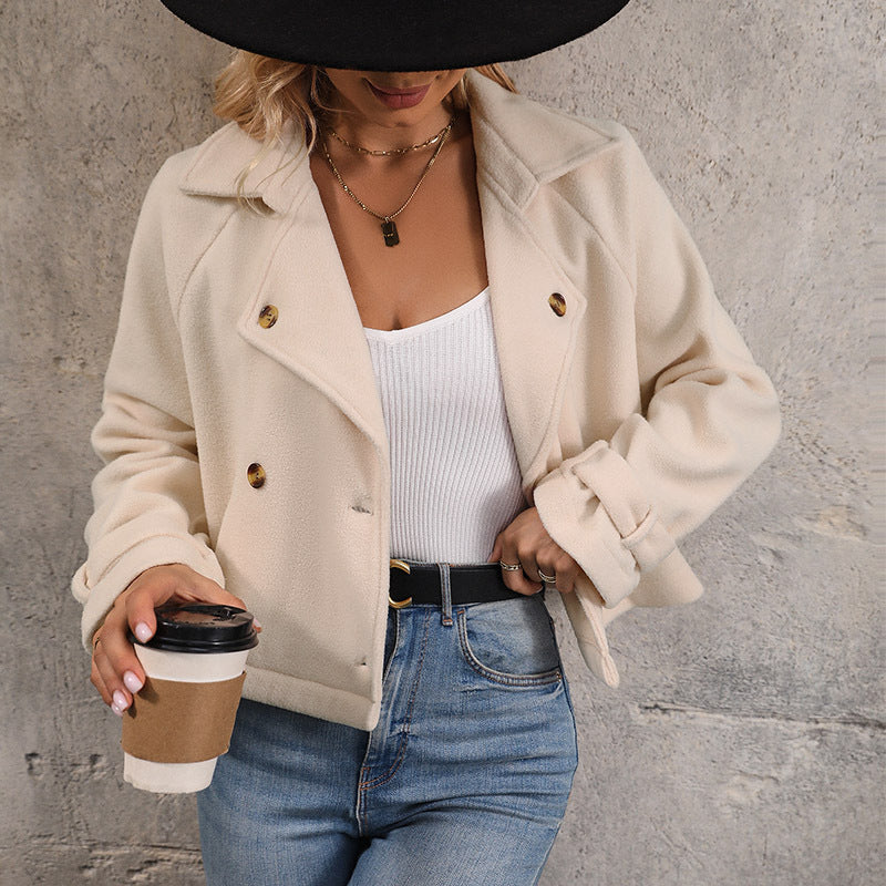 Cream cropped jacket with button cuff tab, front view