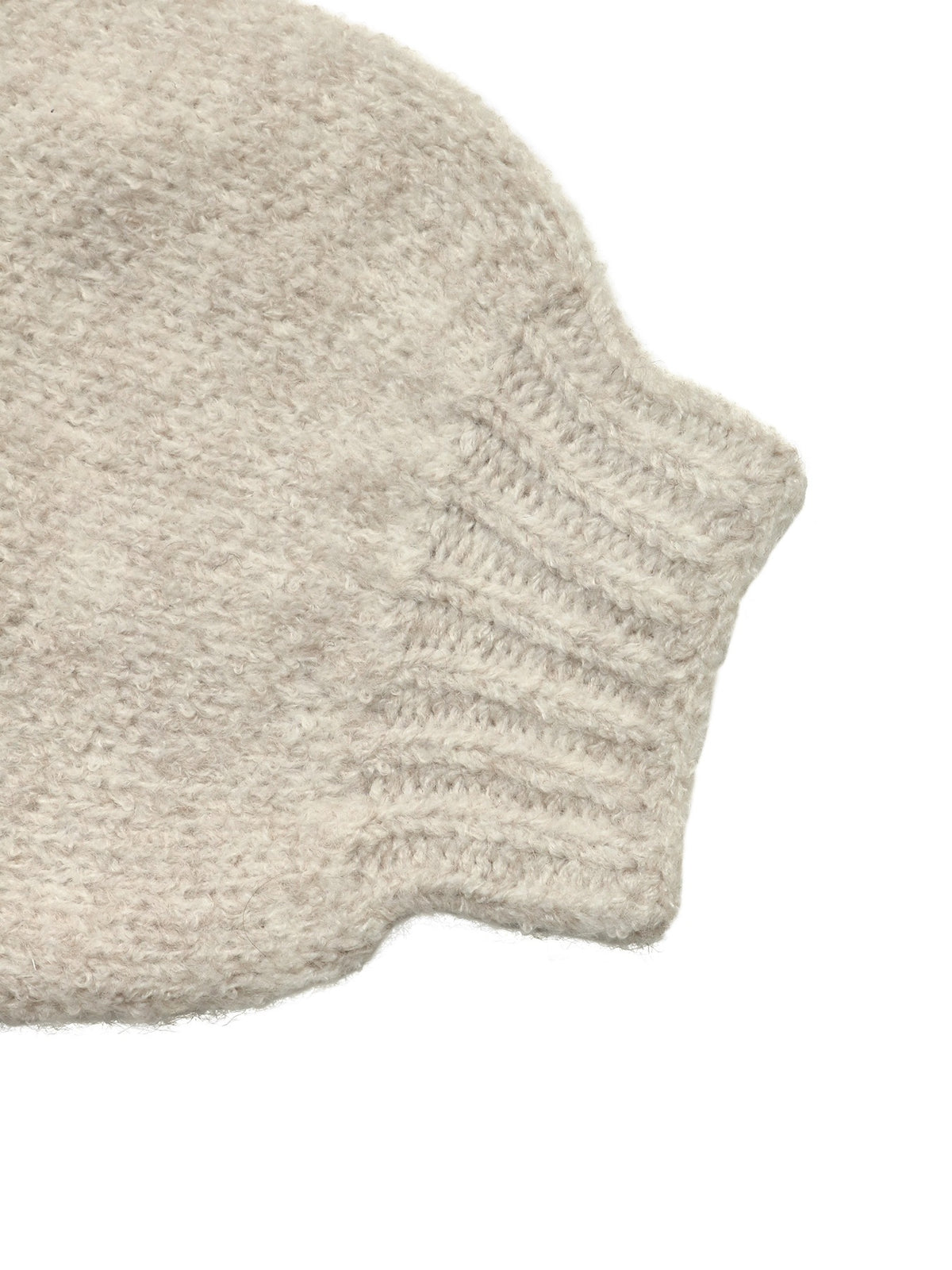 Close-up of a chunky knit beanie in a heathered light oatmeal beige color, showing the ribbed cuff detail against a plain white background.