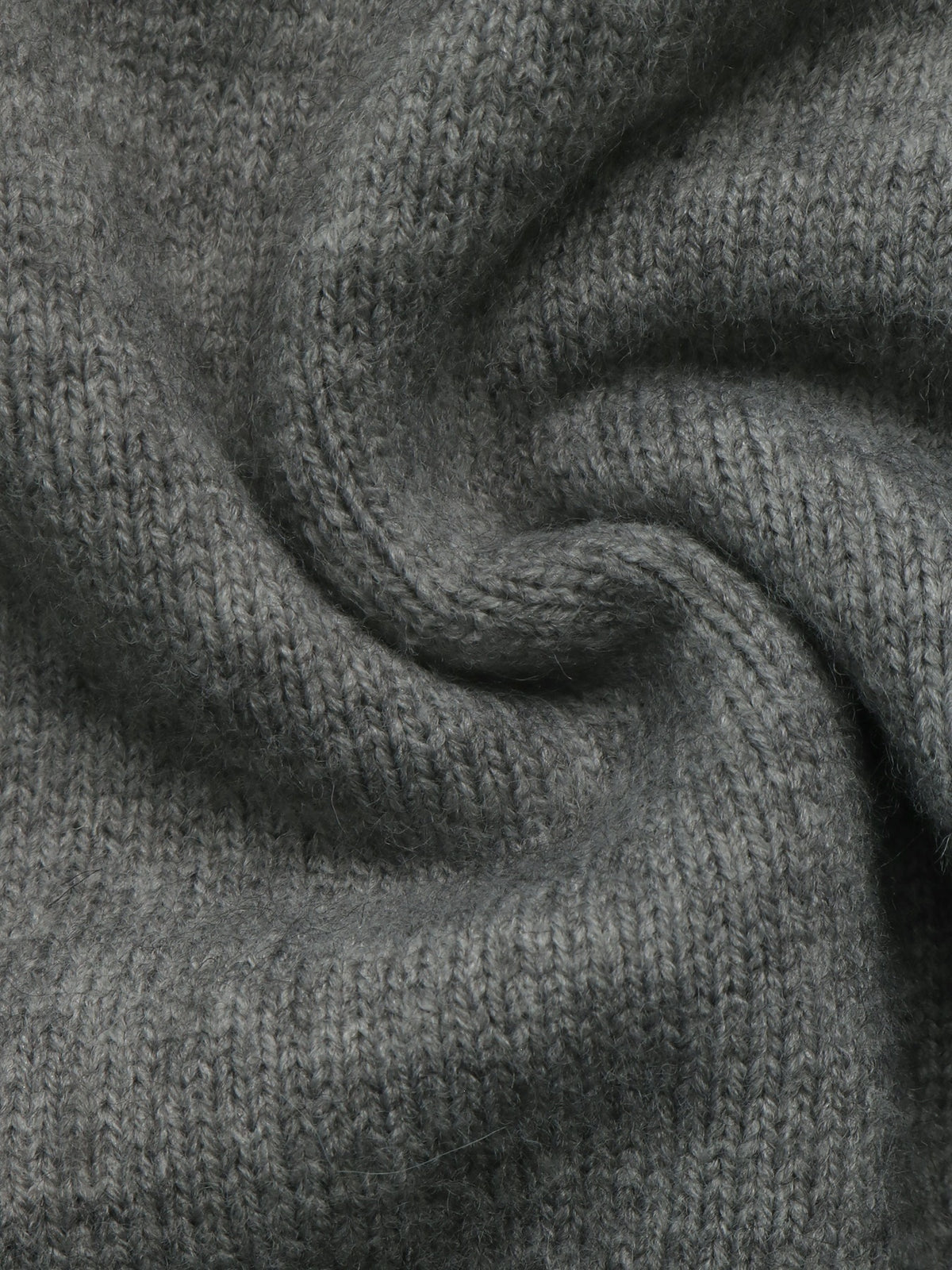 A close-up of a dark gray knitted fabric with a soft, textured weave, shown in a gentle swirl pattern.