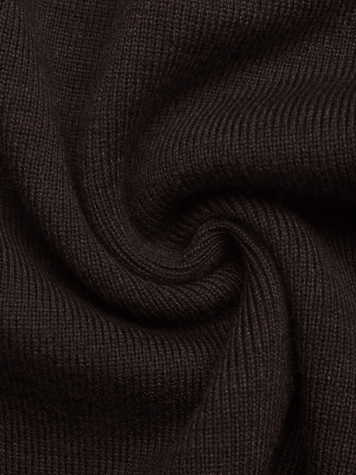 A close-up of dark brown ribbed knit fabric, swirled to show the texture and weave.
