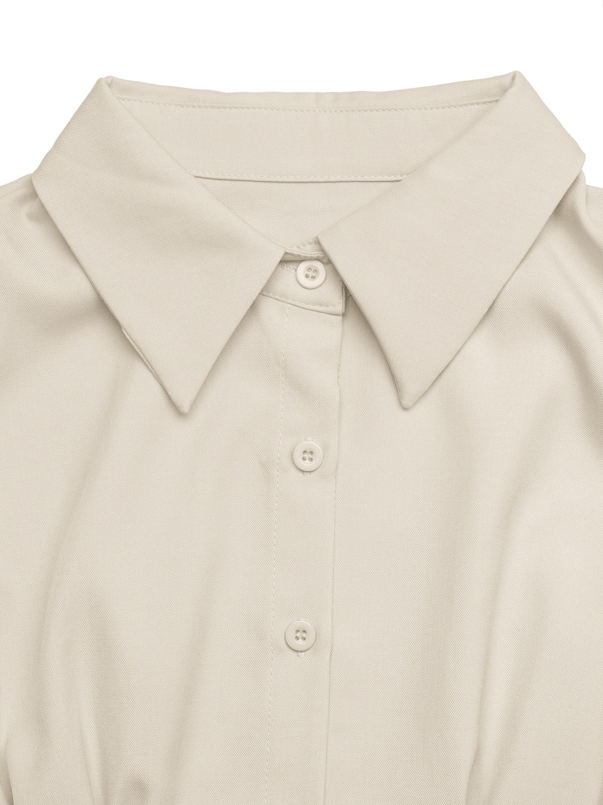 Close-up of a light beige or cream-colored collared button-up shirt, showing the collar, front placket, and matching buttons against a clean white background.