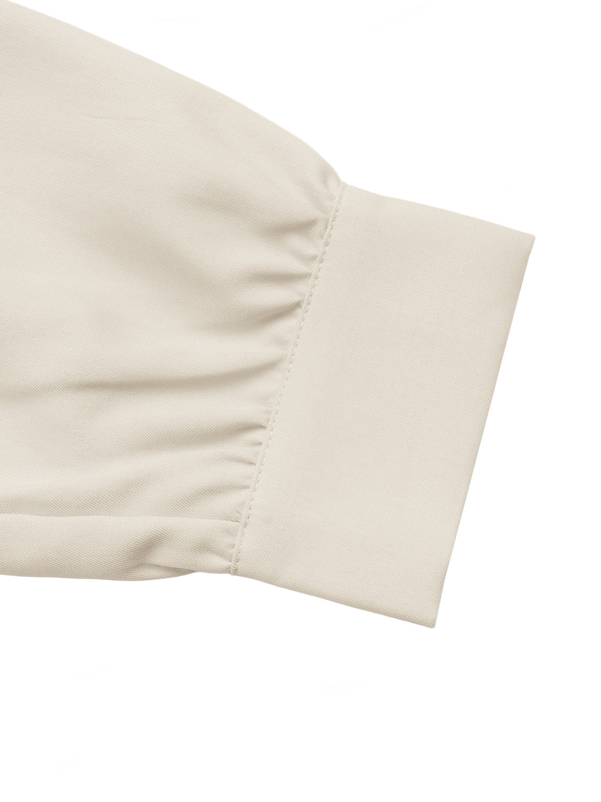 Close-up of a light beige or cream-colored fabric sleeve cuff with gathered pleats and a clean stitched edge, shown on a plain white background.