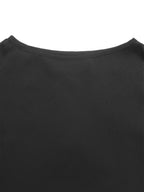 Close-up of a black crew-neck garment, showing the fabric texture and neckline against a plain white background.
