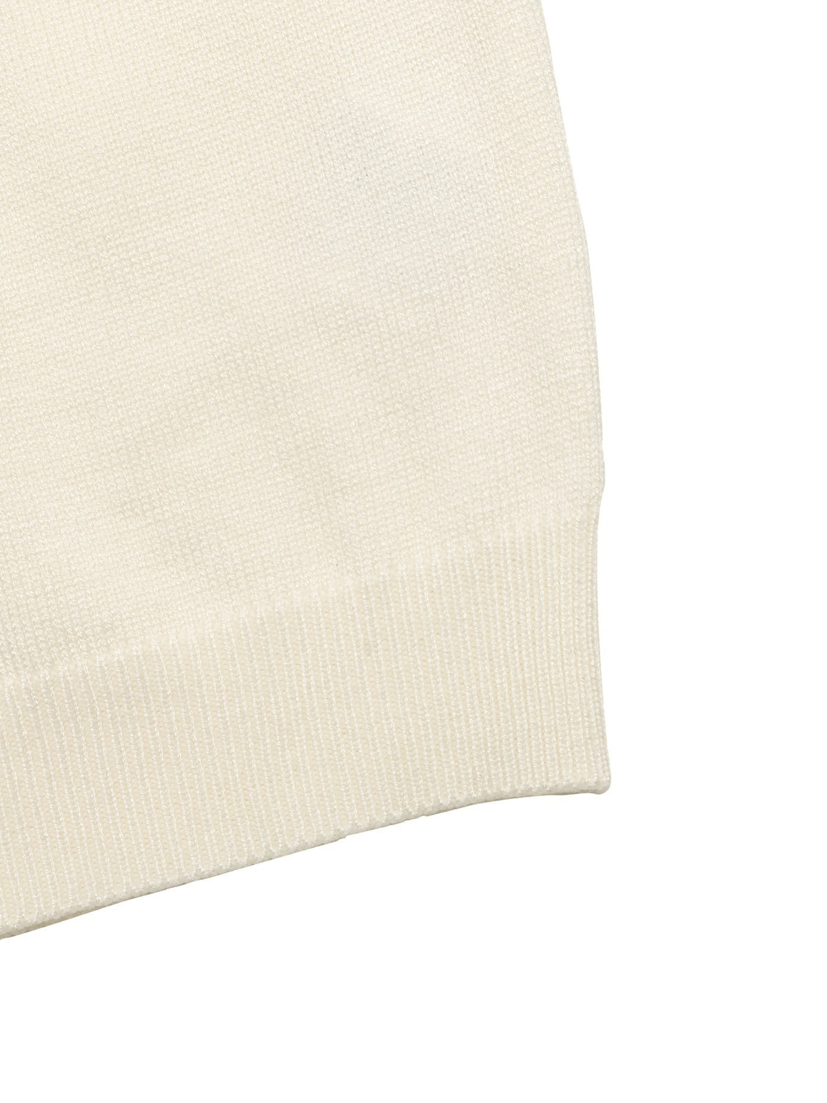 Close-up of a cream-colored ribbed knit fabric cuff on a white background.