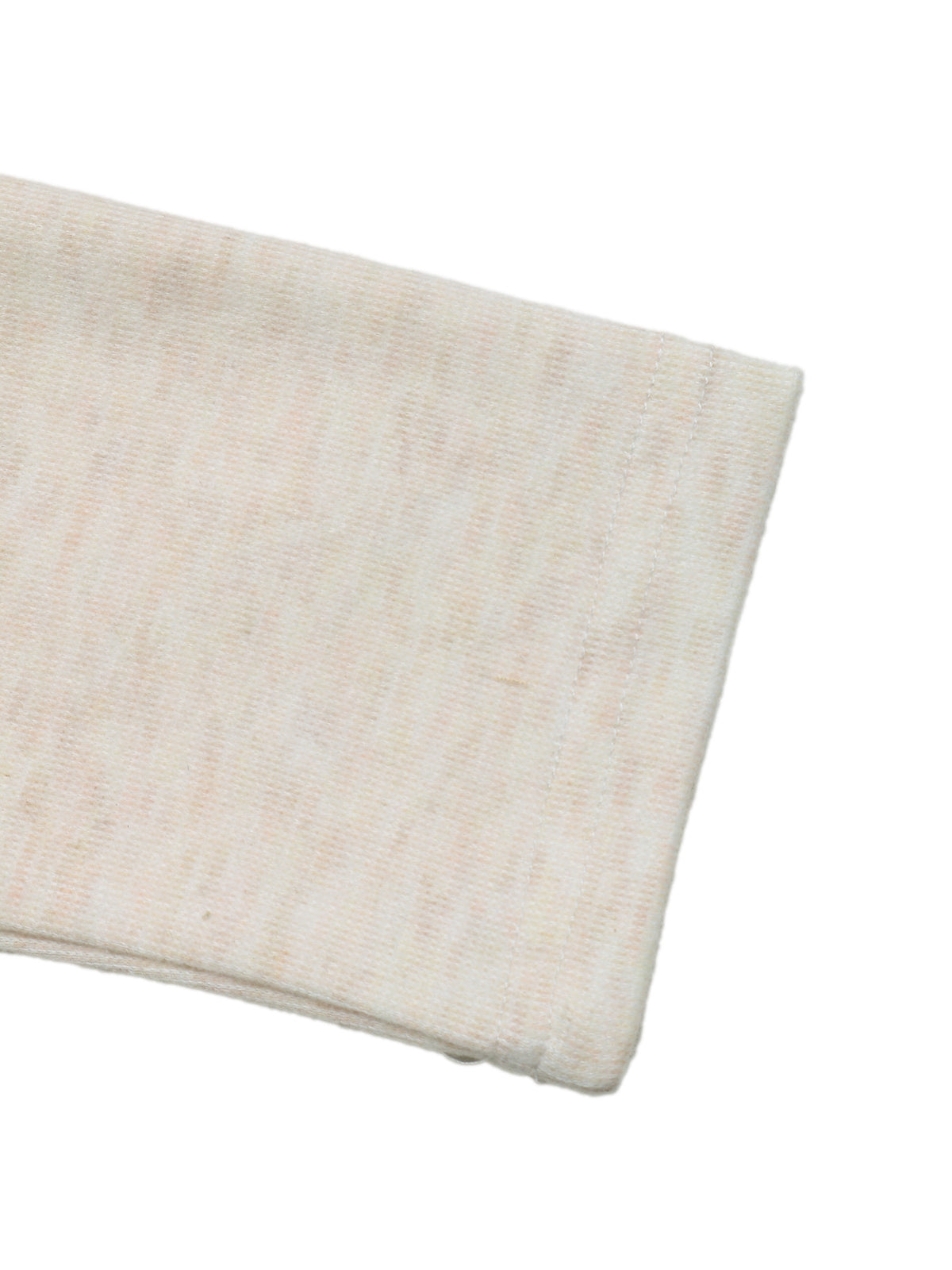 A close-up of a folded cream-colored ribbed knit fabric, likely a sweatshirt sleeve, on a solid white background.