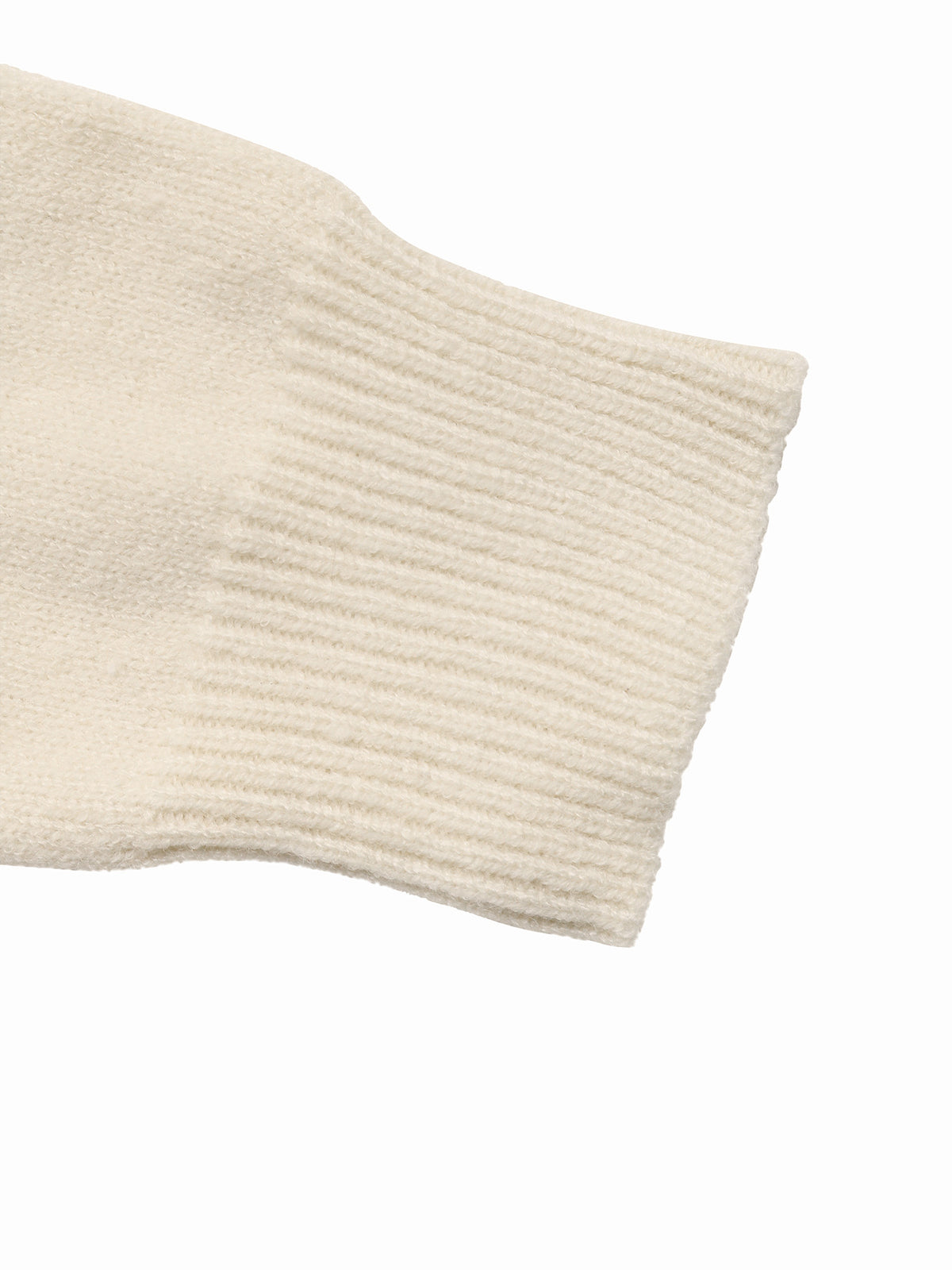 Close-up of a cream-colored ribbed knit sleeve on a plain white background.