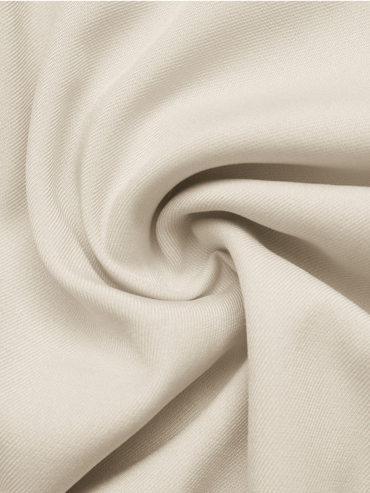 A close-up of draped off-white fabric with a soft, textured weave and gentle folds.