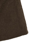 Close-up of a dark brown ribbed knit fabric, showing the texture and hem detail against a plain white background.