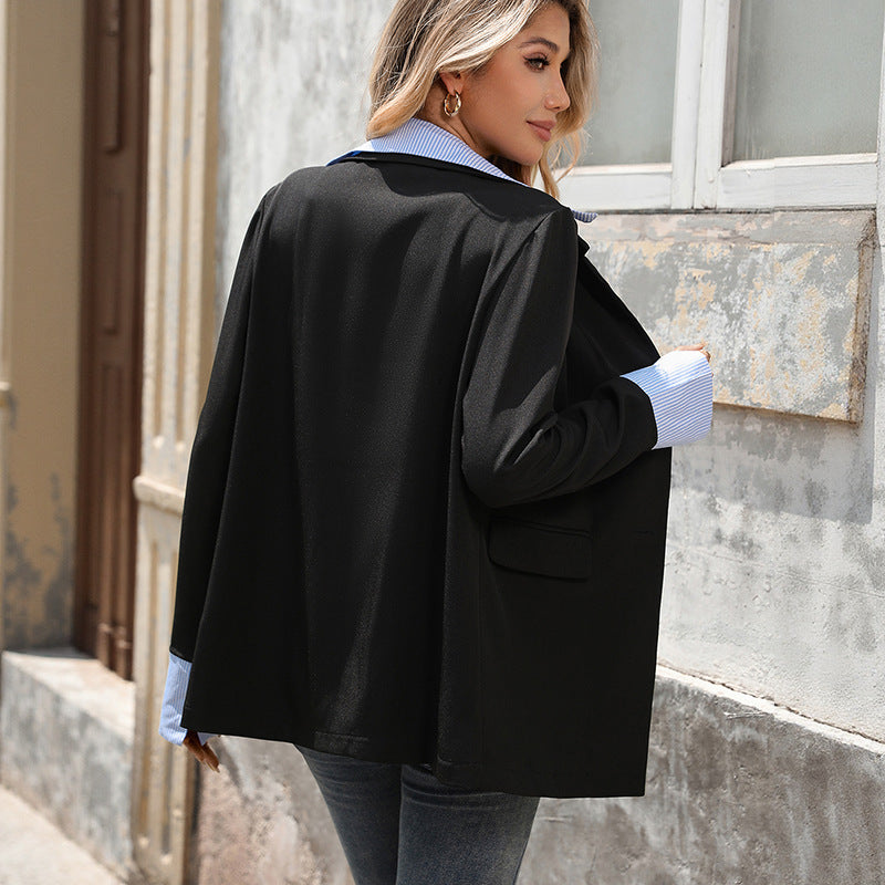 Back view of the black blazer with striped shirt collar