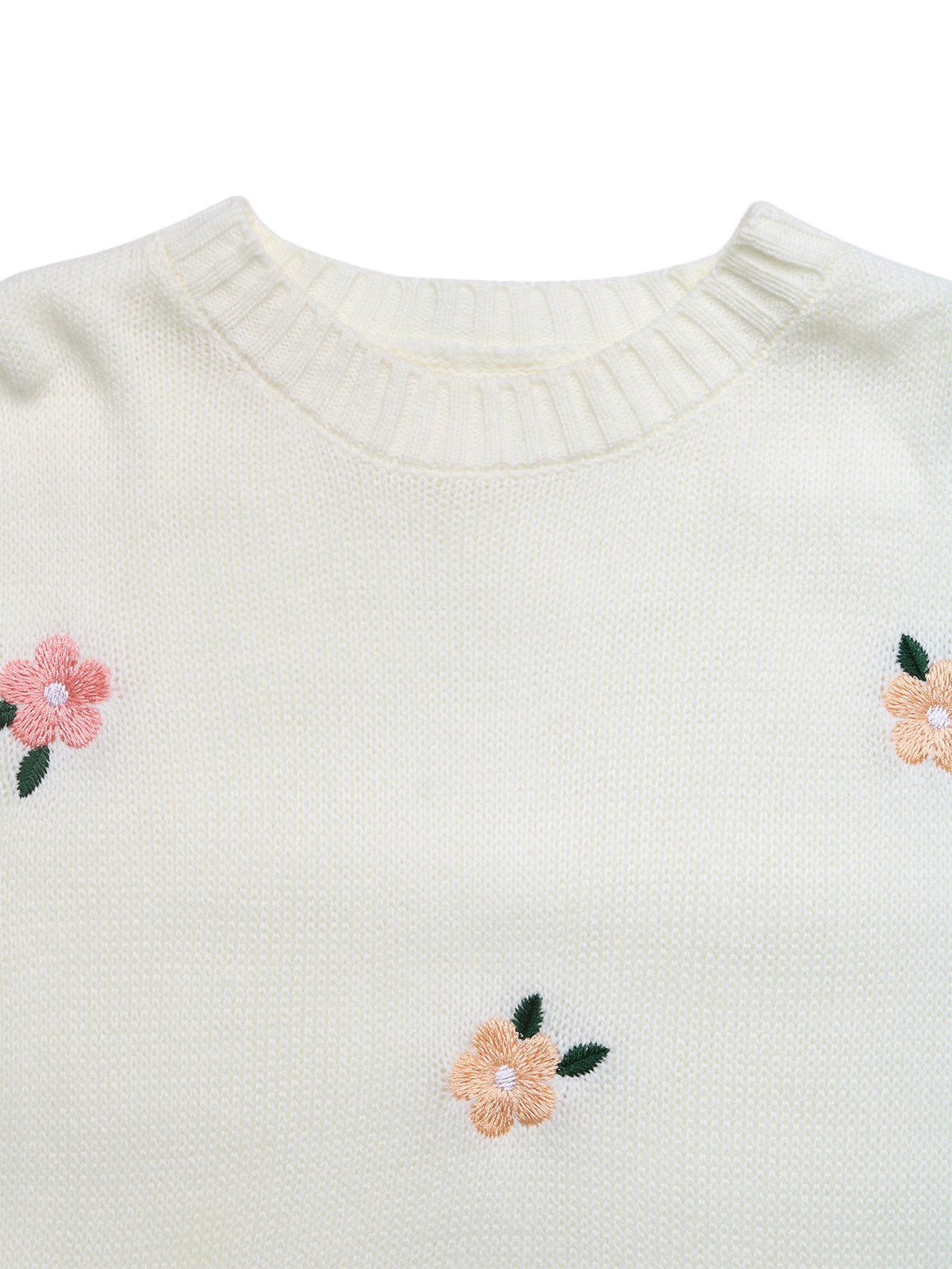 Close-up of a cream-colored knit sweater featuring embroidered peach flowers with green leaves on the chest.