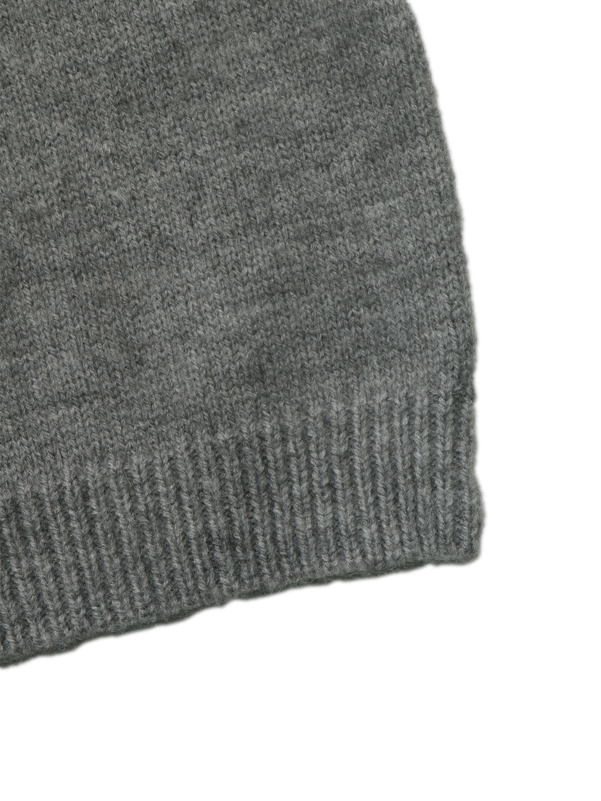 Close-up of a dark gray knit fabric with a ribbed cuff, shown against a plain white background.