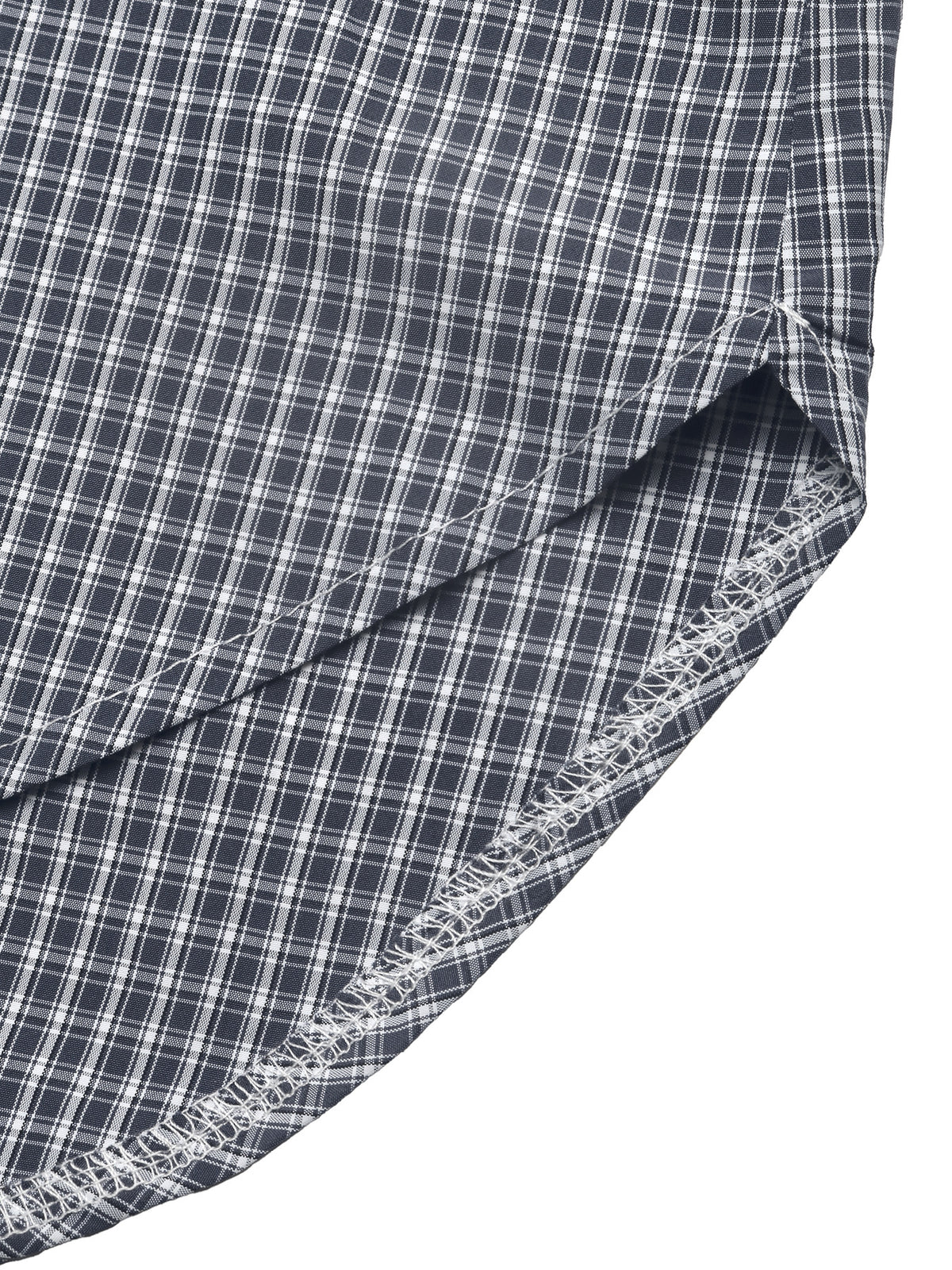 Close-up of a folded plaid fabric with a dark navy and white checkered pattern, showing the texture and raw stitched edge against a white background.