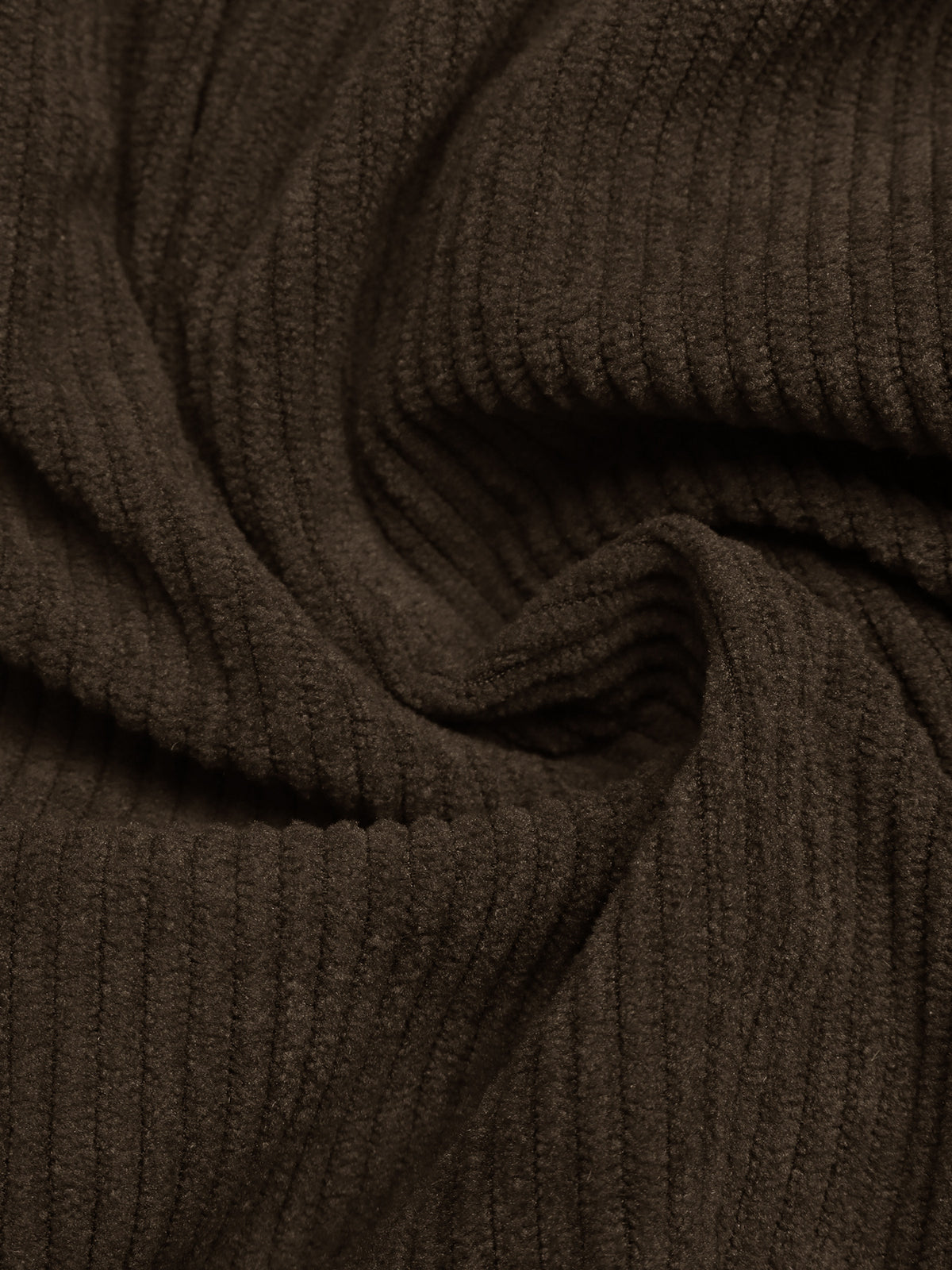 A close-up of dark brown ribbed knit fabric with a soft, draped texture.