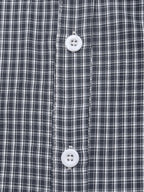 Close-up of a navy and white plaid button-down shirt showing the front plaid pattern and white buttons.