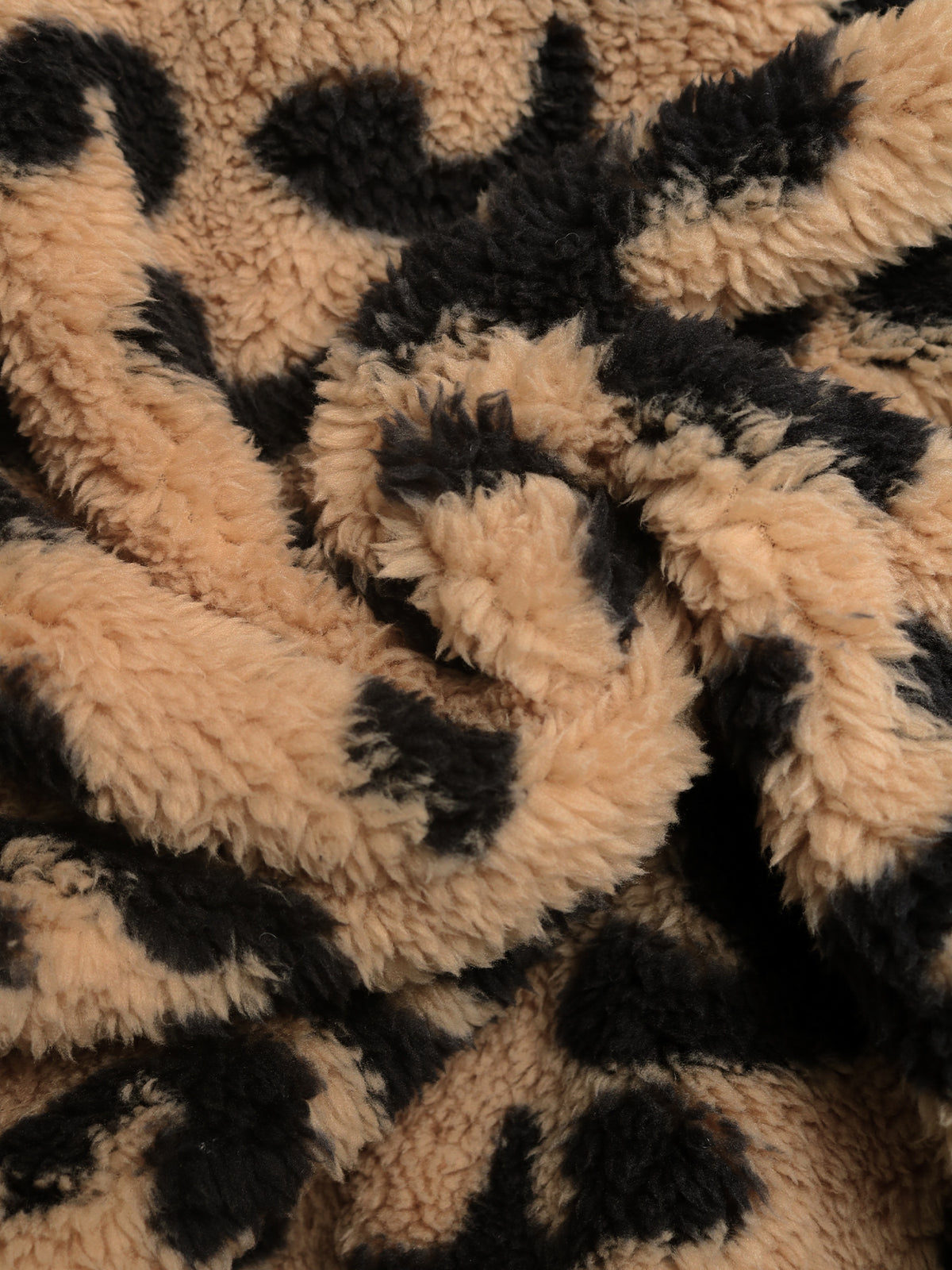 Close up of the soft leopard print teddy fleece fabric
